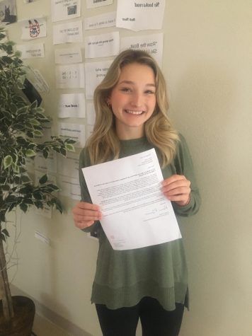 Allie Lively with her acceptance letter from Washington University in St. Louis